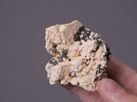 PHENAKITE   on ORTHOCLASE
