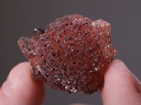 RHODOCHROSITE with MANGANITE  on KUTNOHORITE