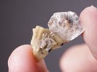 GENTHELVITE   on POLYLITHIONITE
