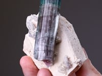 ELBAITE   on Feldspar